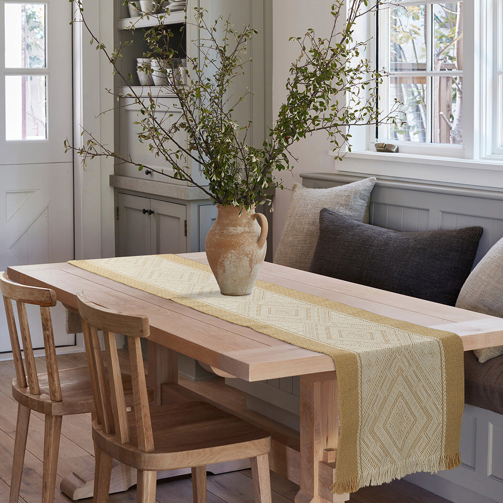 Handwoven table and console runner made of cotton blend fabric with geometric diamond pattern and fringes