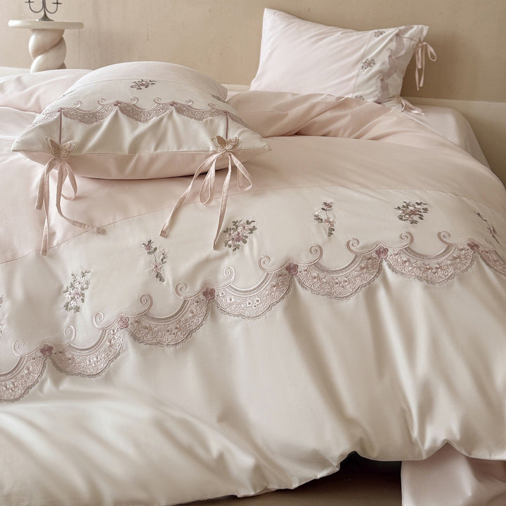 Luxurious embroidered satin bedding set with ruffled hem