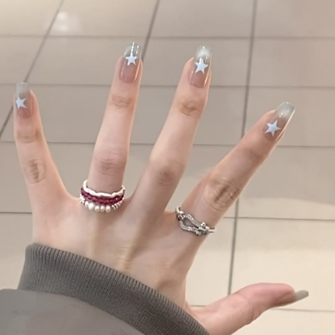 Artificial fingernails with star motif and ombre effect Stornfield