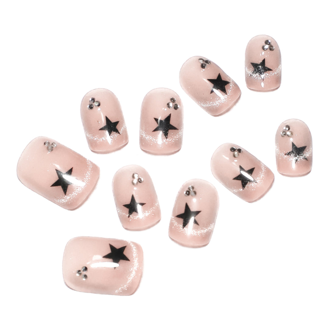 Artistic acrylic nails with glamorous star motifs Stornfield