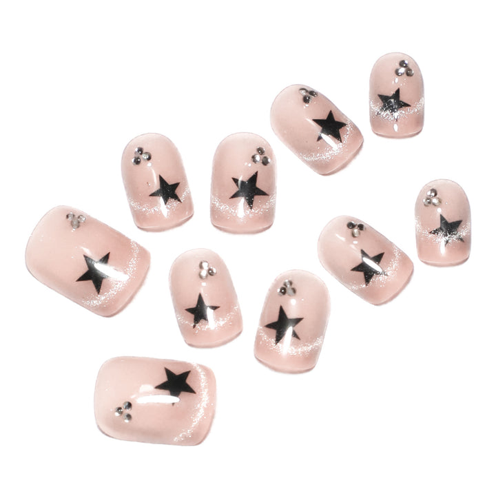 Artistic acrylic nails with glamorous star motifs Stornfield