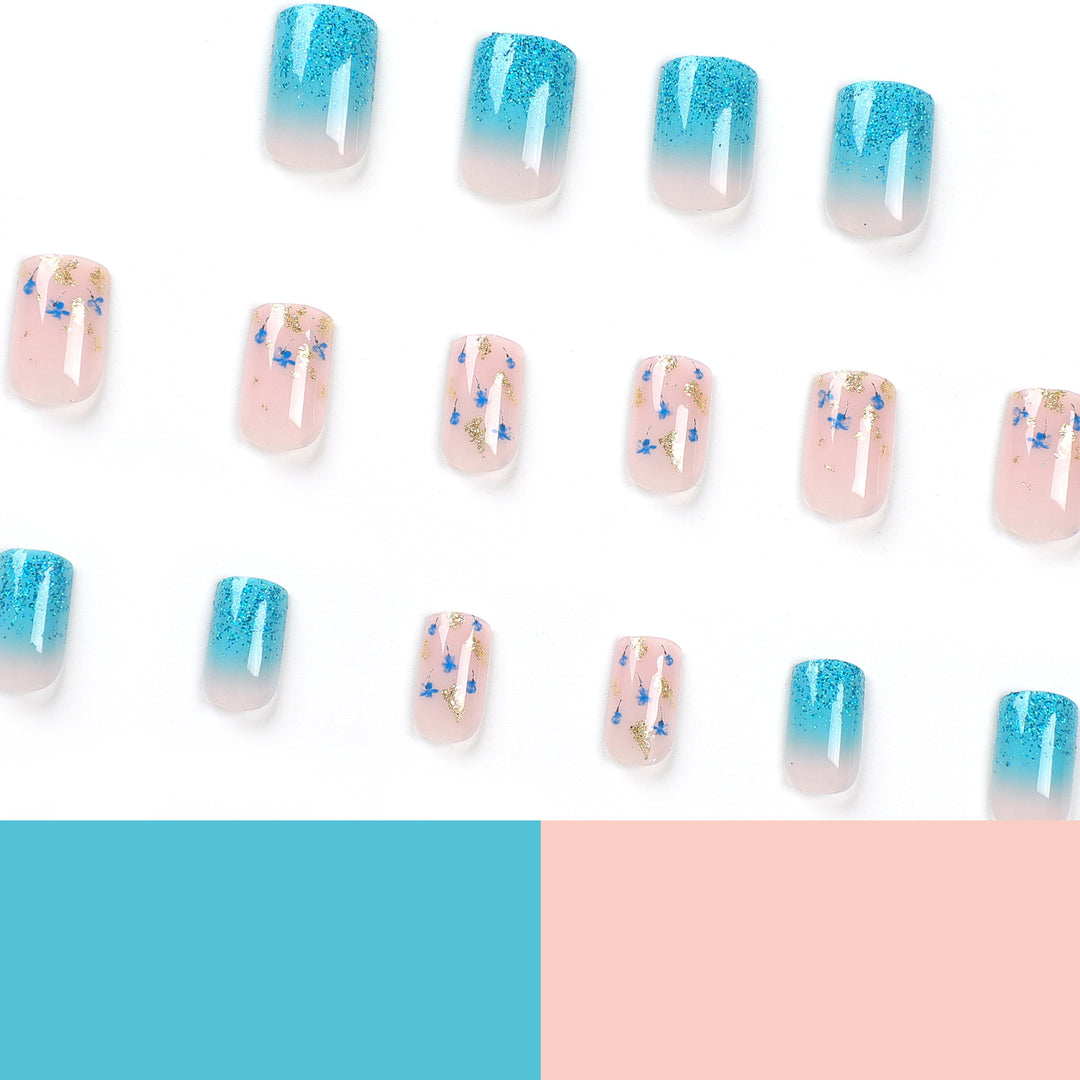 Artful acrylic nails with floral design and glitter effects Stornfield