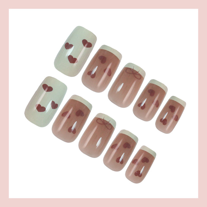 Artifical nails with romantic heart and ribbon designs Stornfield