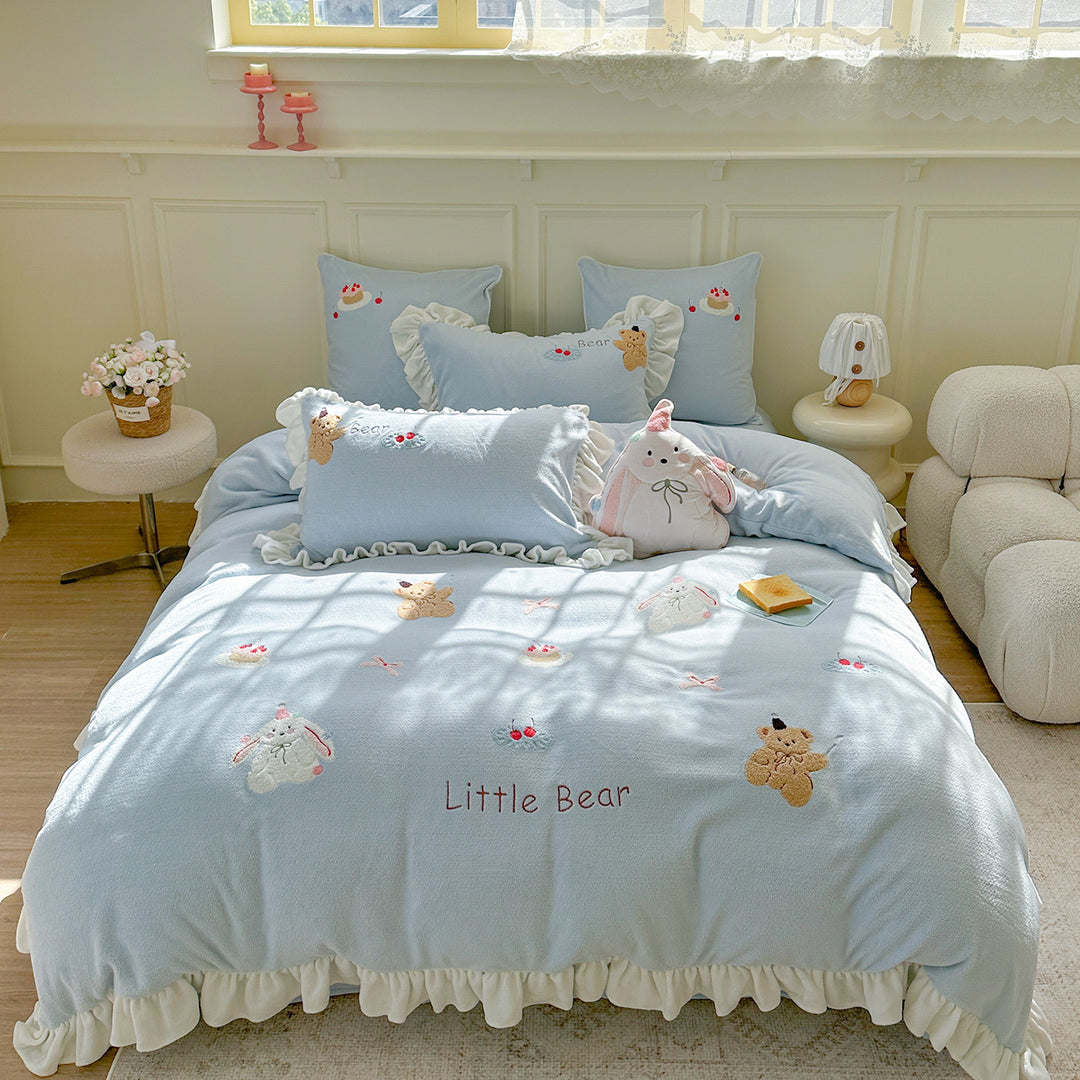 Bedding set with plush surface, ruffled hem and cute embroidery designs