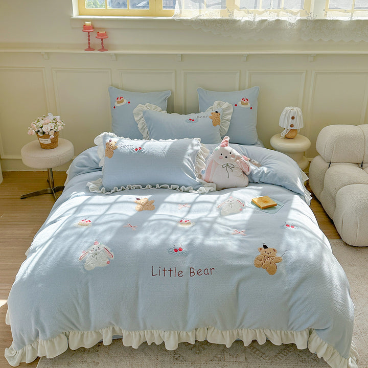 Bedding set with plush surface, ruffled hem and cute embroidery designs