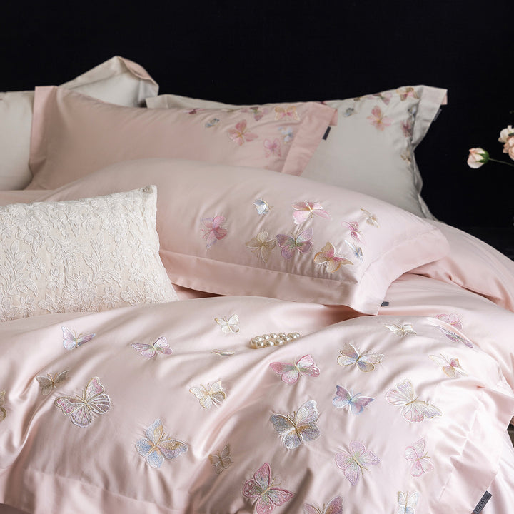 Premium bedding set made of extra soft cotton satin with delicate butterfly embroidery and concealed hotel closure