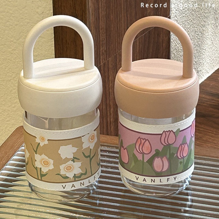 Women's insulated drinking bottle with ergonomic carrying handle and elegant flower design Stornfield