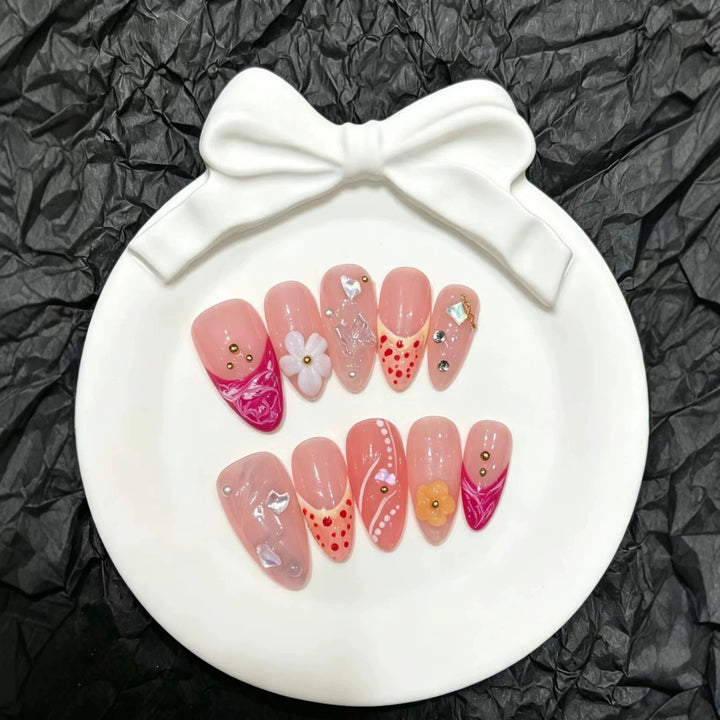 Artistic Press-On Nail Set with Floral and Decorative Elements