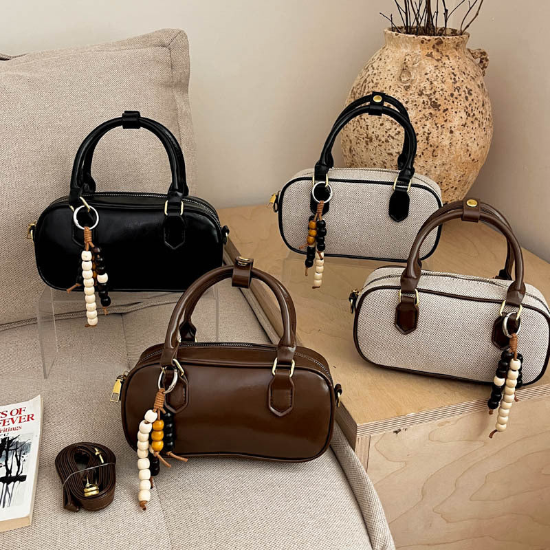 Vintage-Inspired Glossy Handheld Satchel