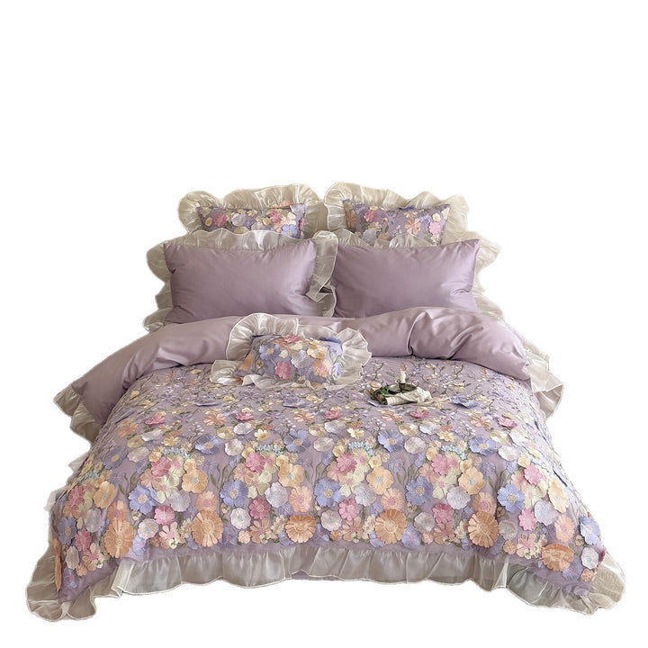 Embroidered bedding set with 3D flower application and ruffle hem