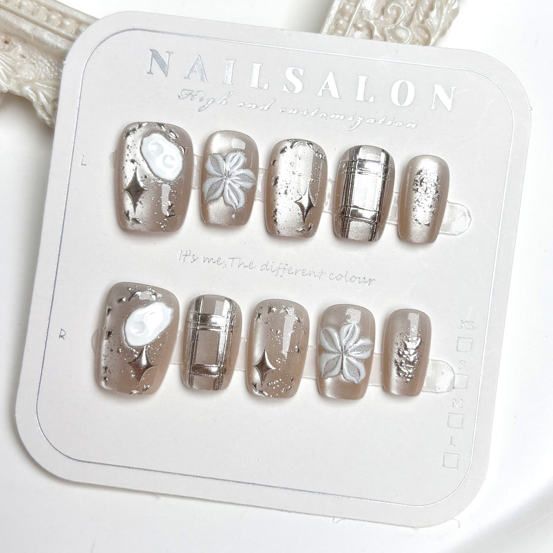 Artistic Press-On Nail Set with Floral and Metallic Accents