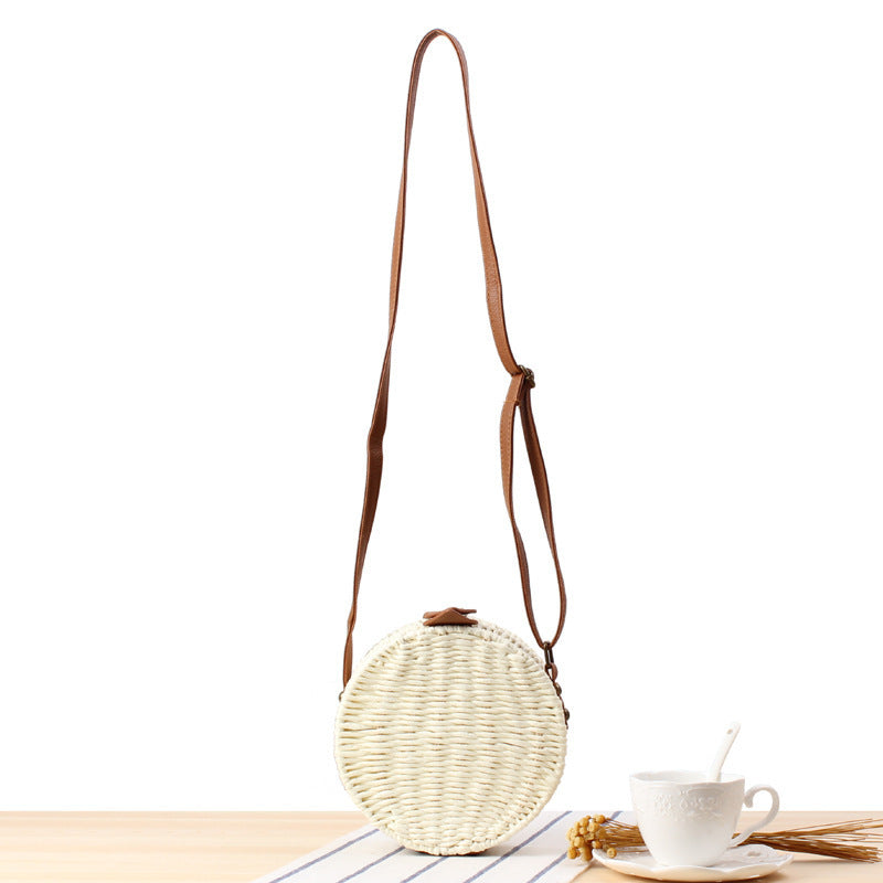 Round basket bag with leather accents Stornfield
