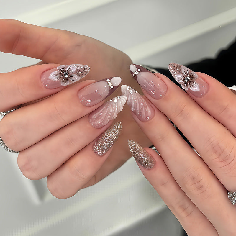 Artificial nail set with elegant flower and glitter accents Stornfield