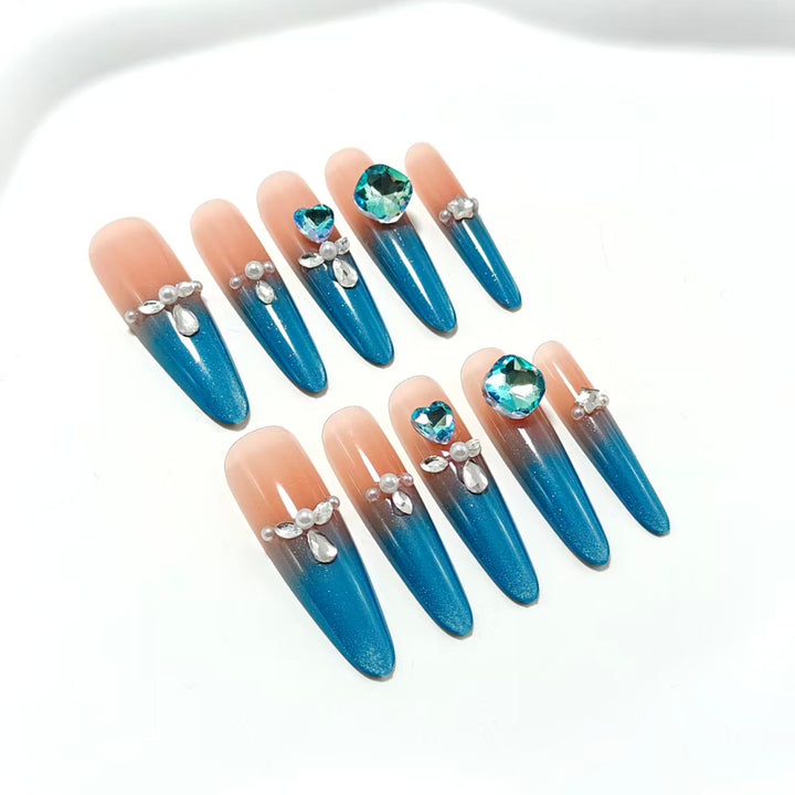 Artificial nails with glitter and rhinestone embellishments Stornfield