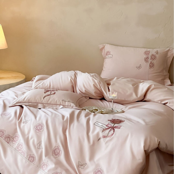 Luxurious cotton satin bed linen set with rose embroidery and butterfly details