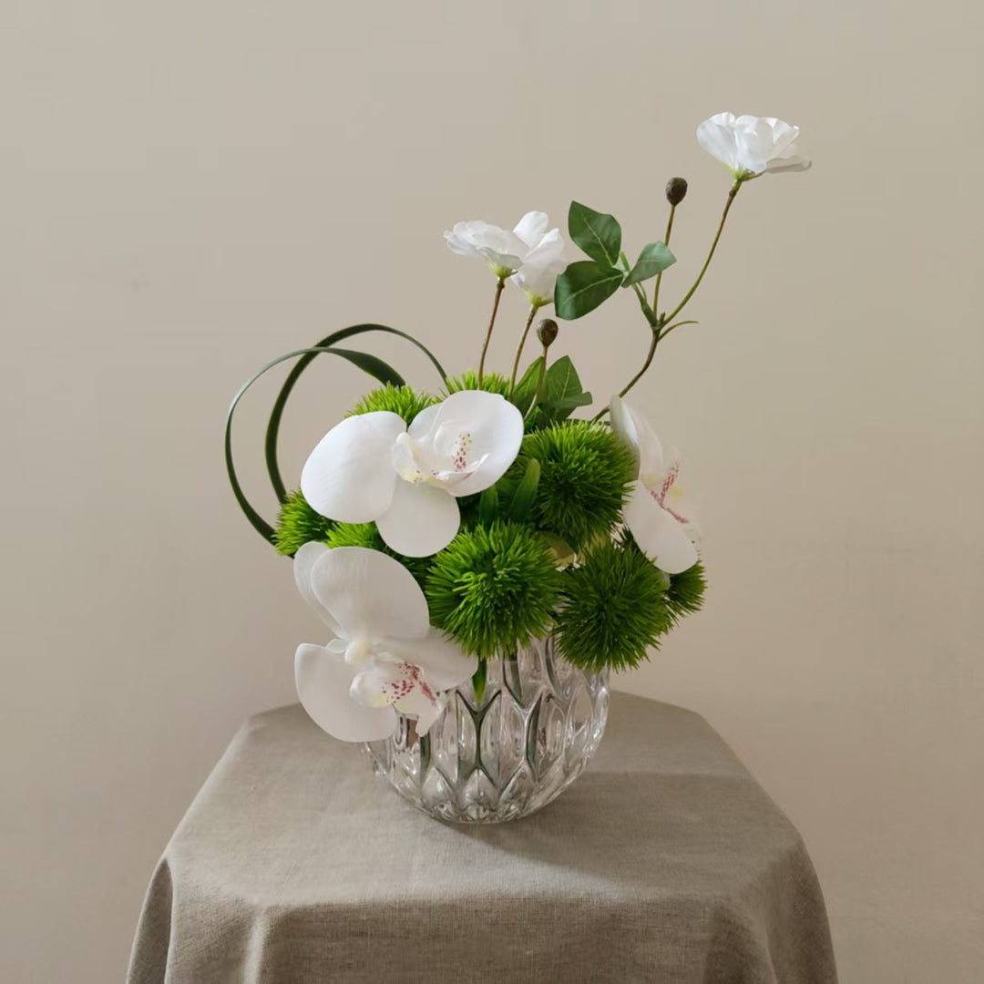 Lifelike Orchid and Greenery Floral Arrangement