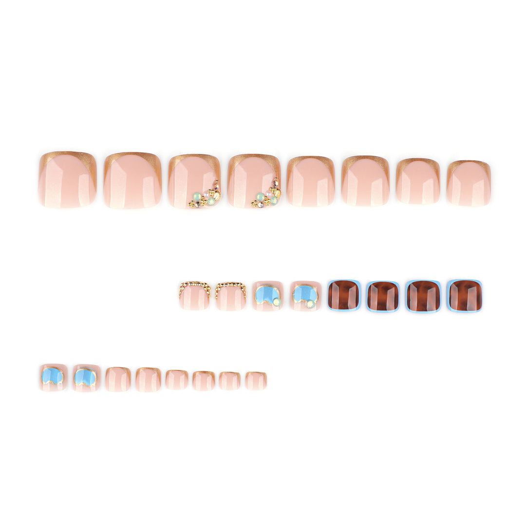 Artistic toenail art with elegant gold design Stornfield