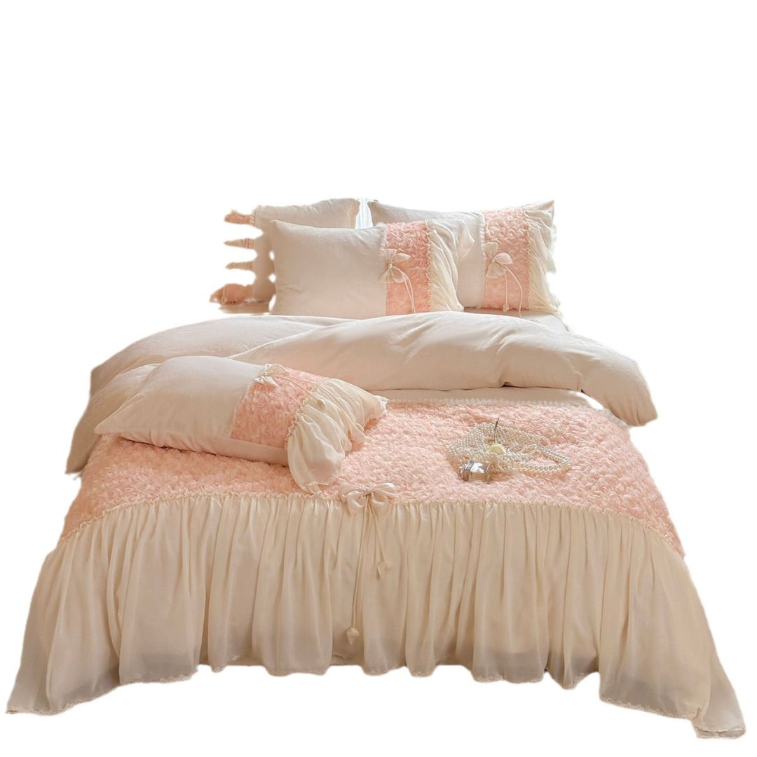 Romantic bedding set with ruffled edges, frills, and decorative accent pillows