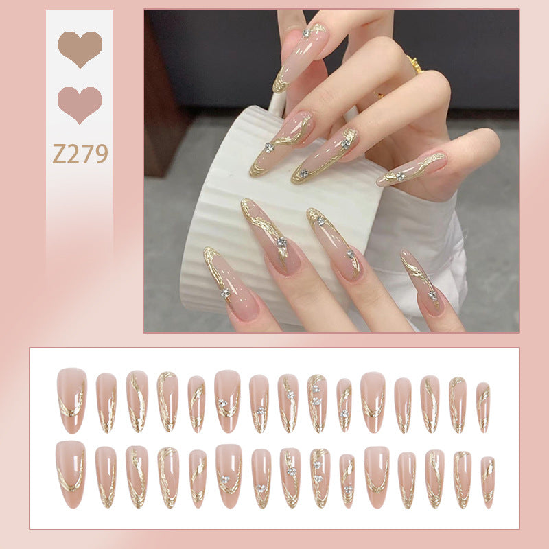 Artificial nail set with elegant gold design and sparkling applications Stornfield