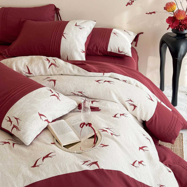 Luxurious cotton bedding set with swallow embroidery and bow accents