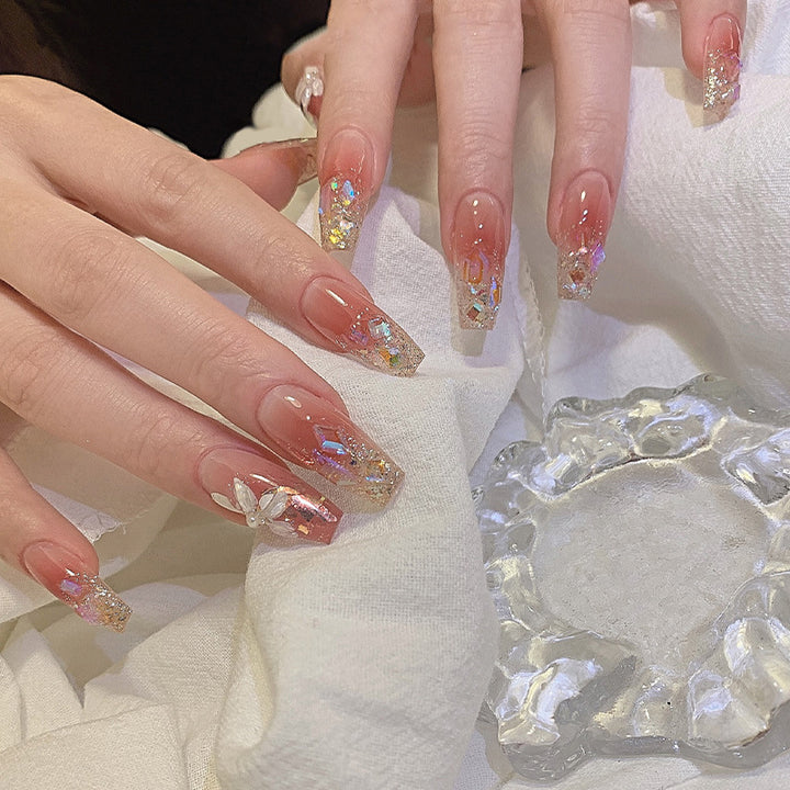 Artificial nail set with floral and glittering accents Stornfield