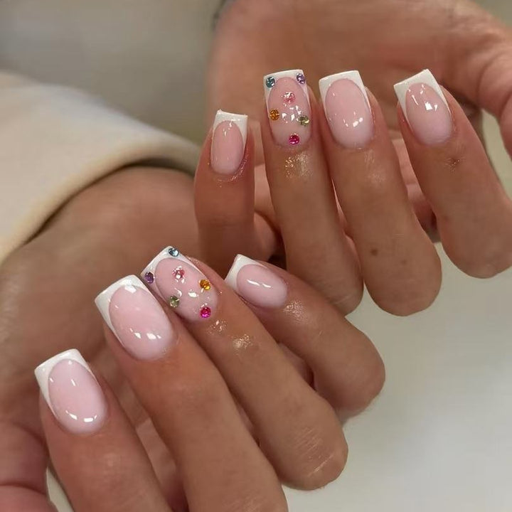 Nail art set with elegant French tips and sparkling rhinestone embellishments Stornfield