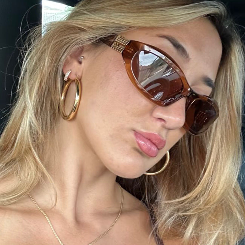 Women’s fashionable sunglasses in a curved design with luxurious details Stornfield