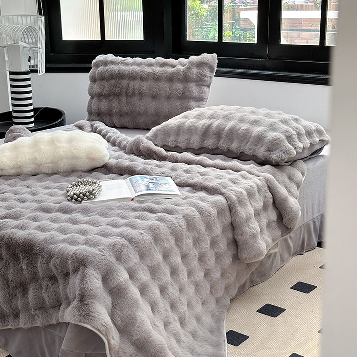 Padded microfiber mattress topper with wave stitching and plush surface