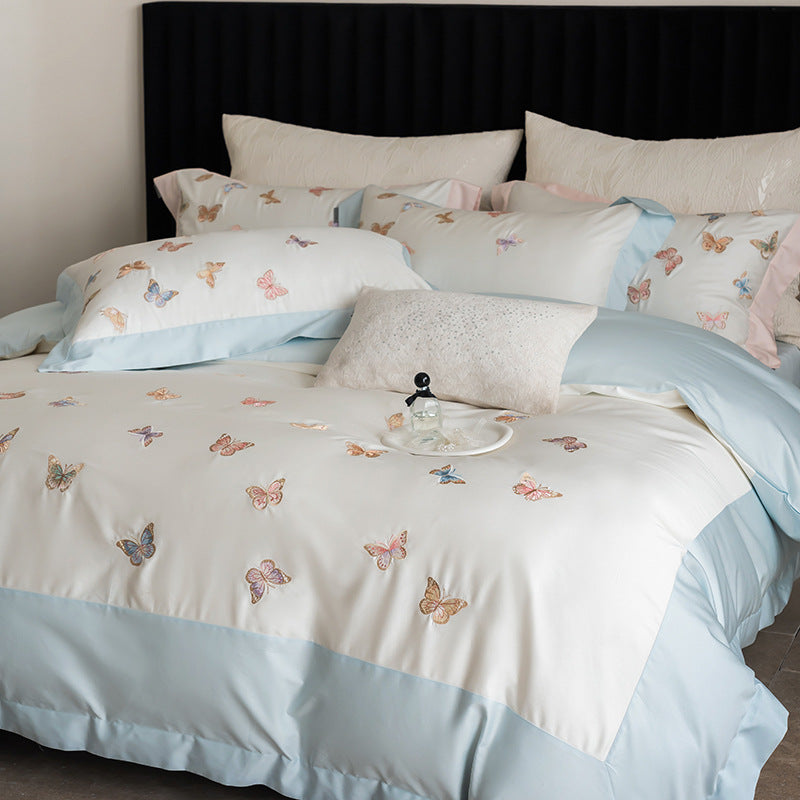 Luxurious cotton satin bedding set with embroidered butterfly appliqués
