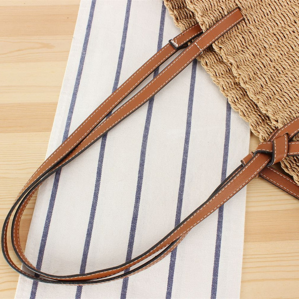 Beach bag made of handwoven natural material with sturdy leather straps Stornfield