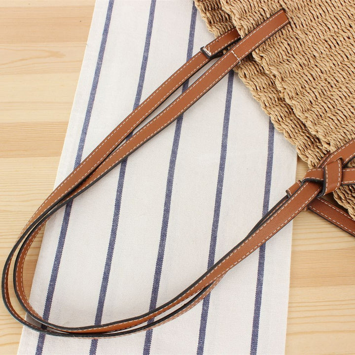 Beach bag made of handwoven natural material with sturdy leather straps Stornfield