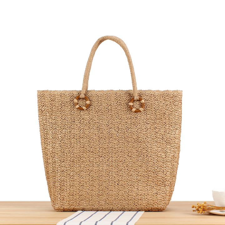 Beach bag made of natural woven material with sturdy carry handles Stornfield