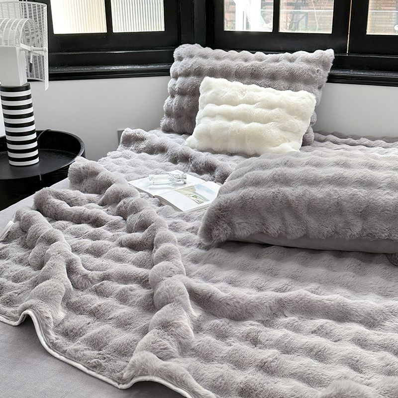 Padded microfiber mattress topper with wave stitching and plush surface