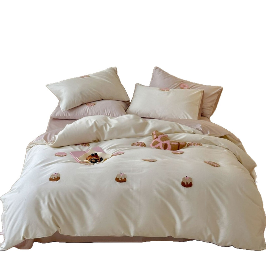 Cotton satin bed linen set with embroidered mini tartlet appliqués