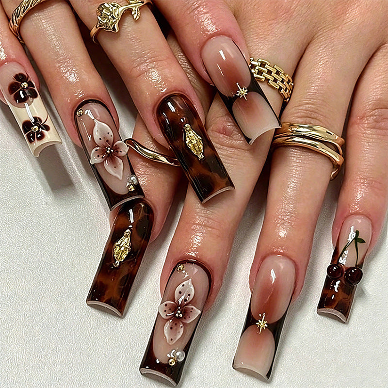 Exclusive artificial nails with elegant animal design and glitter accents Stornfield