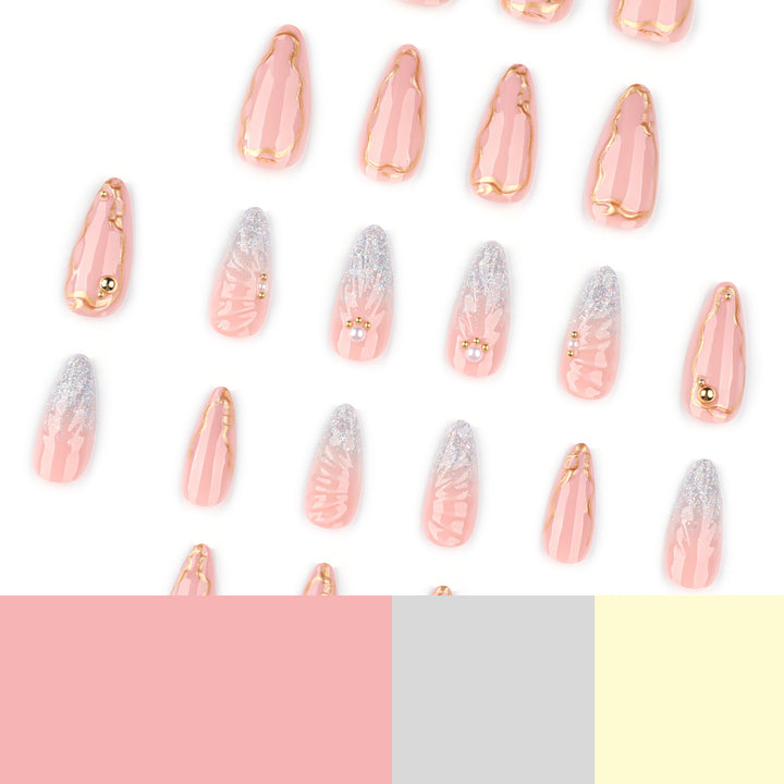 Artful stiletto nails with elegant gold embellishment design Stornfield