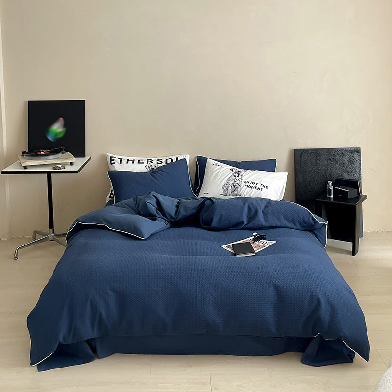 Textured cotton waffle duvet cover with pillowcases and fine contrasting piping