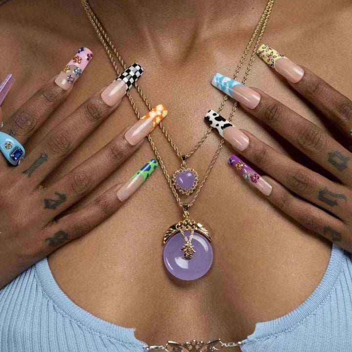 Nail art set with creative designs and shimmering accents Stornfield