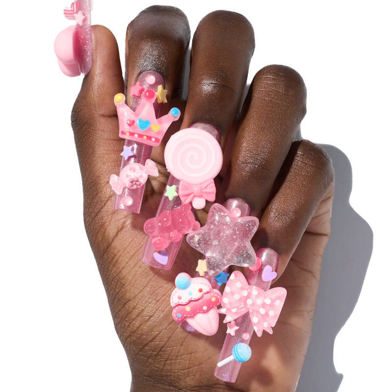 Creative nail art set with playful designs and glitter accents Stornfield