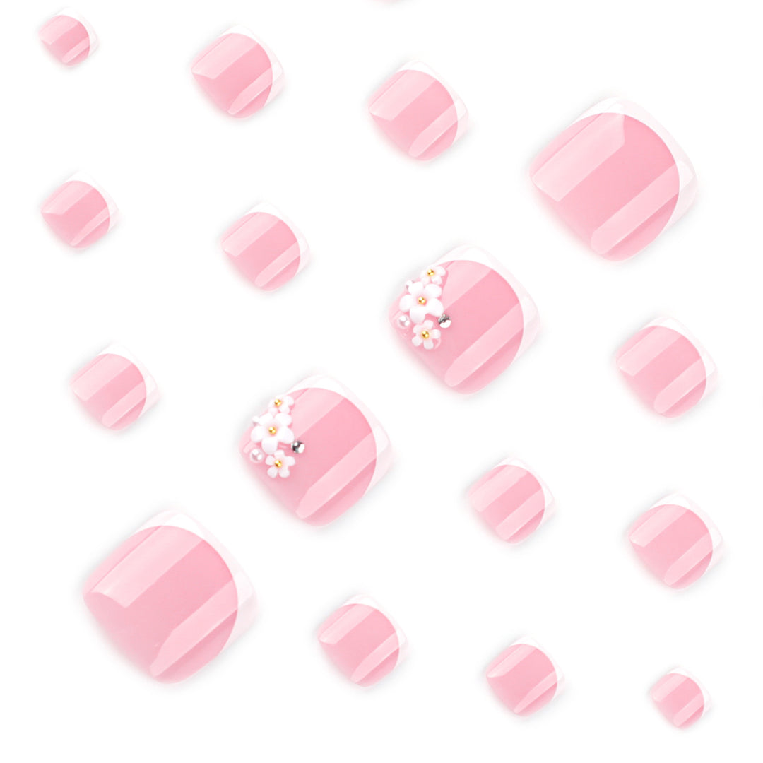 Artful toenail design with delicate flower and French tip accents Stornfield