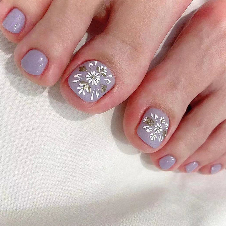 Artistic toenail design with elegant floral design Stornfield