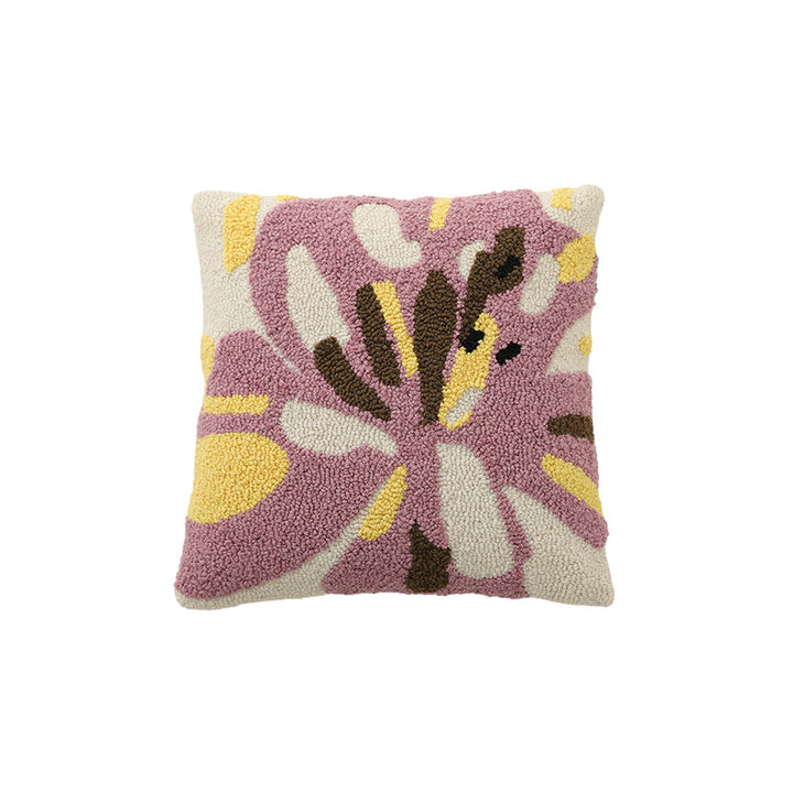 Hand-tufted decorative cushion with abstract graphic design and textured cotton surface