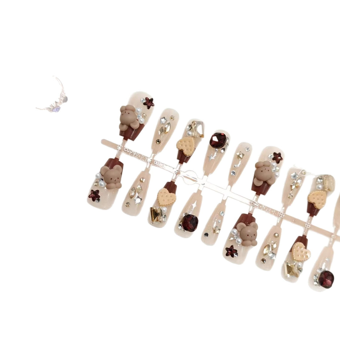 Creative acrylic nails with animal motifs and glitter accents Stornfield