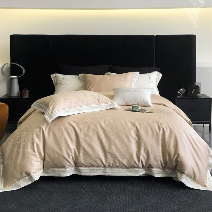 Luxurious satin bedding set with subtle marble texture and golden embroidered border