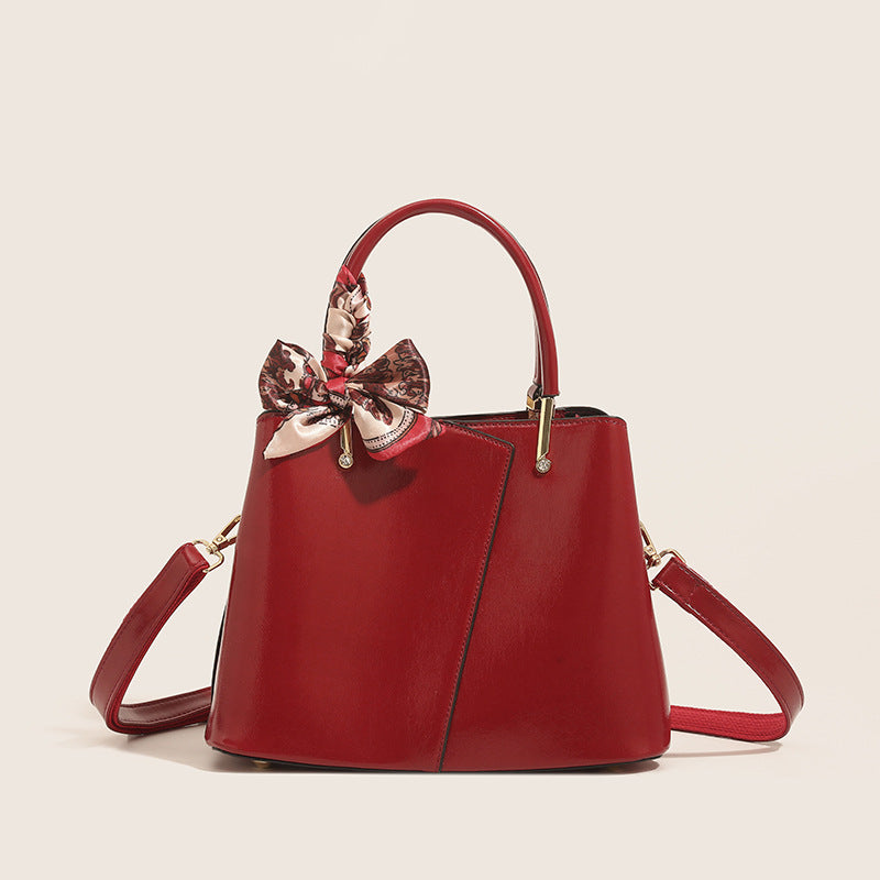 Stylish Structured Handbag with Decorative Scarf