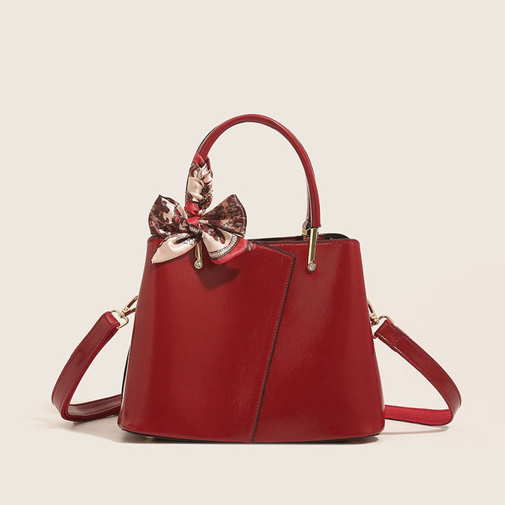 Stylish Structured Handbag with Decorative Scarf