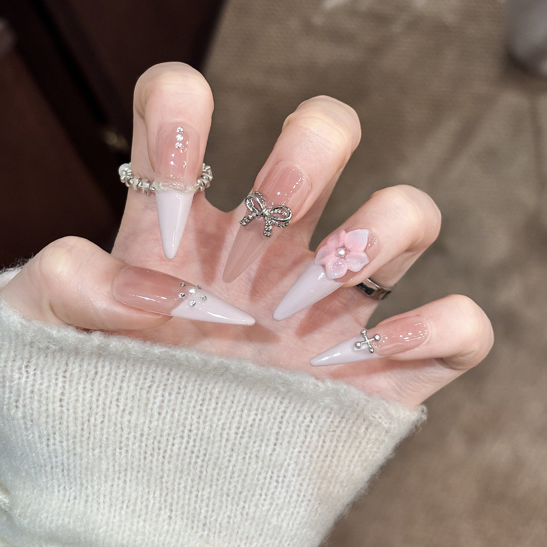 Decorative Stiletto Press-On Nails with Floral Accents and Gem Details