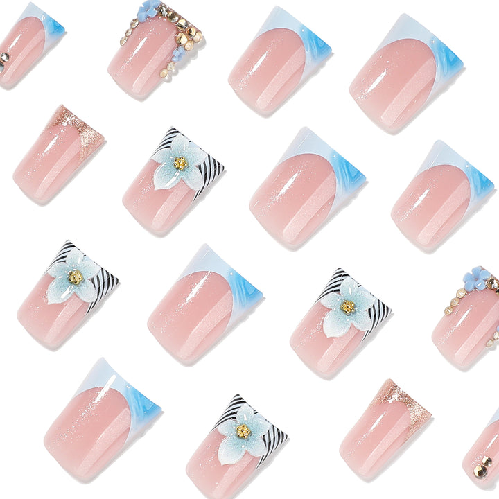 Artful Nail Extensions with Floral Design and Glitter Stornfield