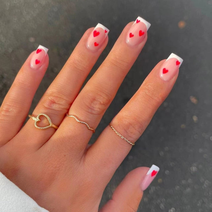 Heart-Embellished French Tip Nail Art Stornfield