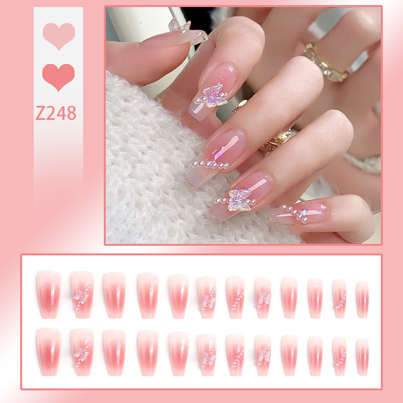 Artificial nails with luxurious pearl and glitter decorations Stornfield